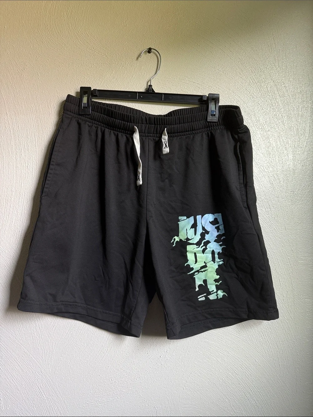 Nike Black Men's Athletic Shorts with Blue-Green Graphic
